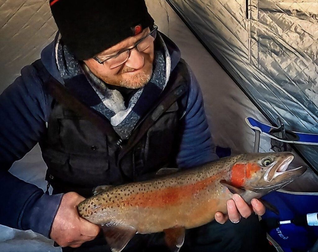 Pete Bowman holding a Rainbow Trout
